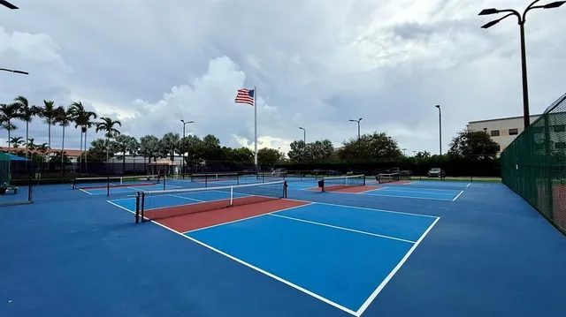 a outdoor space with pool table and chairs