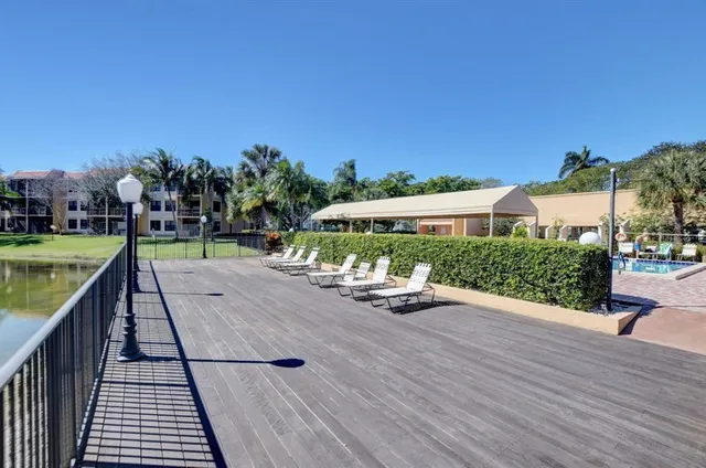 swimming pool view with a seating space