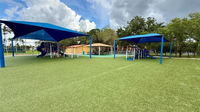 a view of a park with a slide