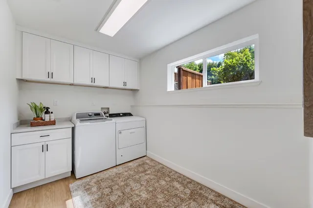 a kitchen with a sink cabinets and window