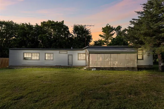 a view of a big yard with an trees