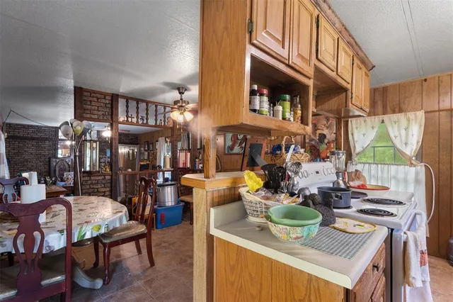 a living room filled with furniture and a window