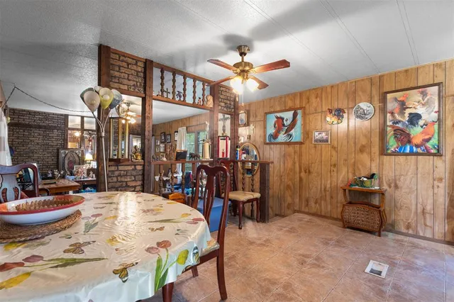 a large kitchen with a table and chairs