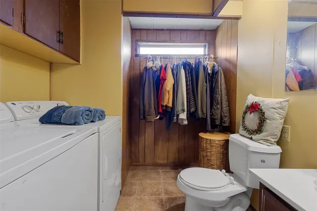 a bathroom with a toilet sink and shower