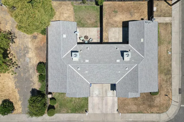 an aerial view of a house with a swimming pool