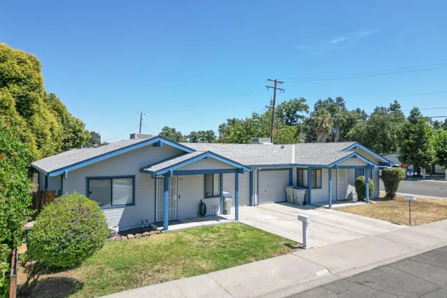 a front view of a house with a yard
