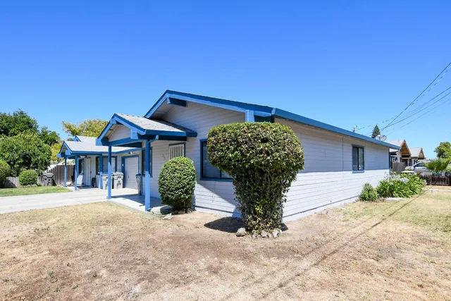 a front view of a house with garden
