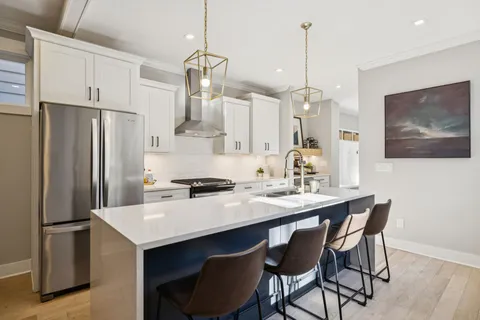 a view of an entryway with wooden floor and door
