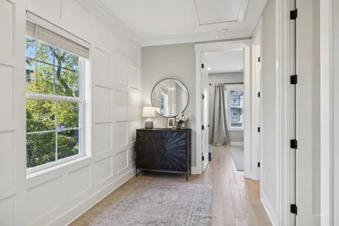 a view of a balcony with trees