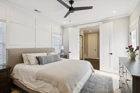 a bedroom with a bed and a view of bathroom