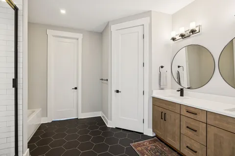 a bedroom with a bed and a night stand