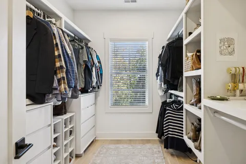 a view of a backyard with potted plants