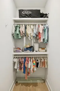 a sign on a wall next to a lake