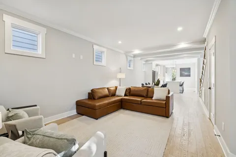 a view of a dining room with furniture and a potted plant