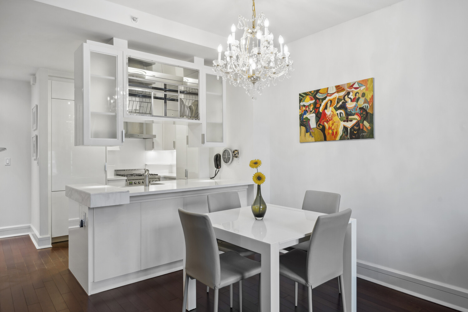 60 Riverside Boulevard, Unit 1806 Manhattan, NY 10069 - Photo 3 of 16 a view of a dining room with furniture and chandelier