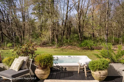 a view of a backyard with garden and patio