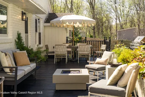 a view of outdoor seating space and wooden floor