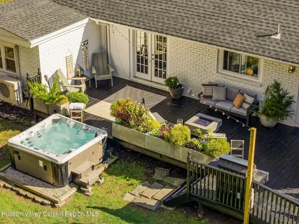 swimming pool view with a seating space