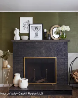 a stone wall with a fireplace