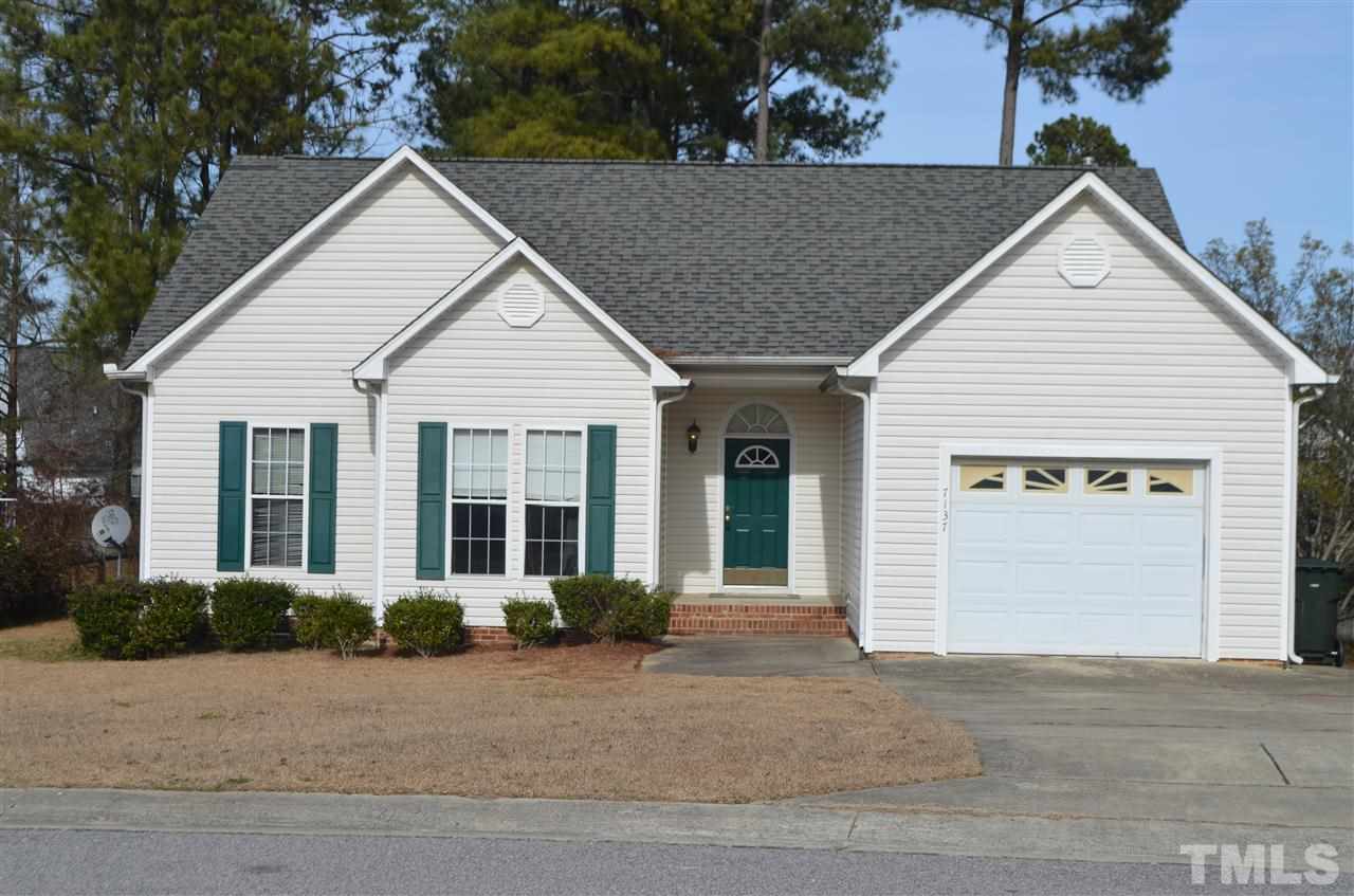 7137 Spanglers Spring Way Raleigh, NC 27610 - Photo 1 of 8 front view of a house and a yard