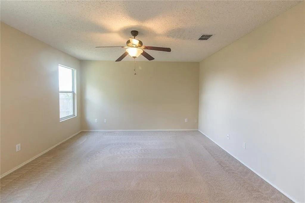 118 Scarlet View Anna, TX 75409 - Photo 10 of 16 an empty room with windows and fan