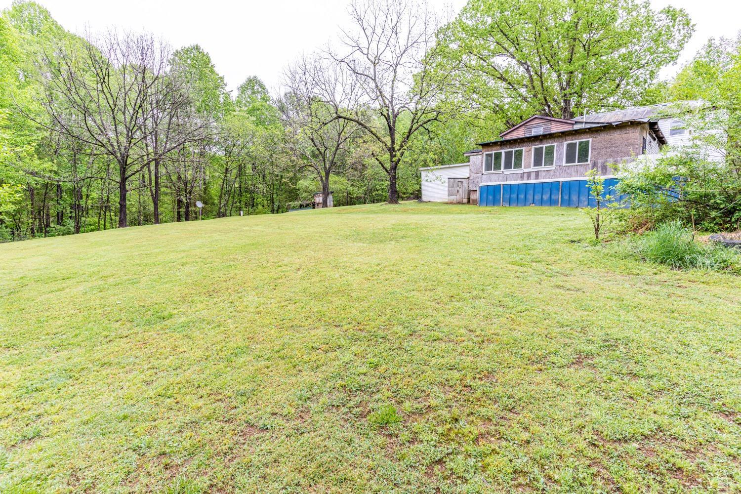 1283 Boxwood Farm Road Amherst, VA 24521 - Photo 54 of 65 a view of a house with a yard and sitting area