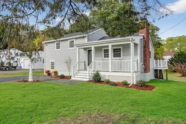 a front view of house with yard and green space