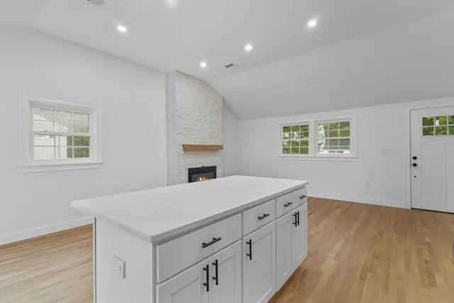 a room with a bed and a dresser