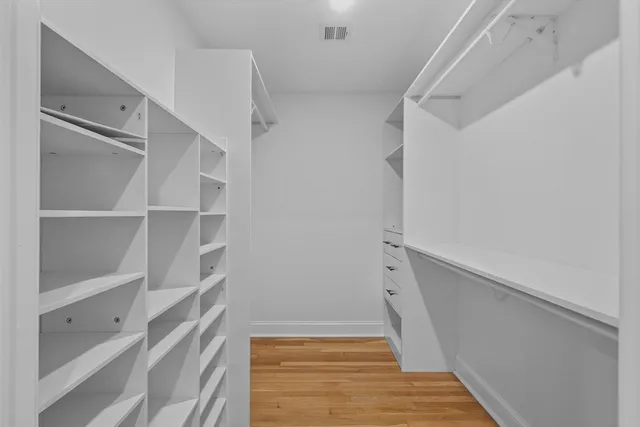 a view of an empty walk in closet