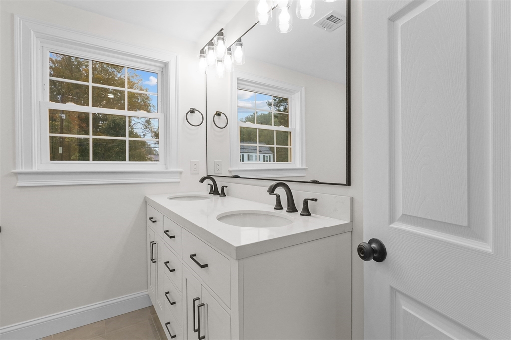 217 Central Street Framingham, MA 01701 - Photo 20 of 42 a bathroom with a sink and a mirror