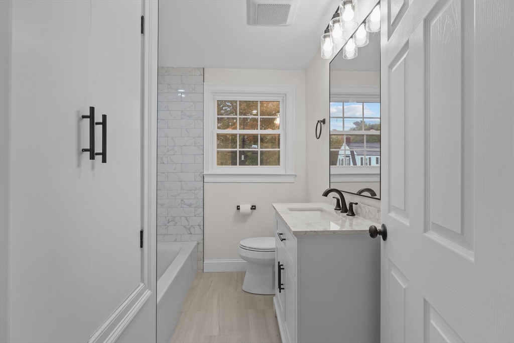 217 Central Street Framingham, MA 01701 - Photo 24 of 42 a bathroom with a sink toilet and window