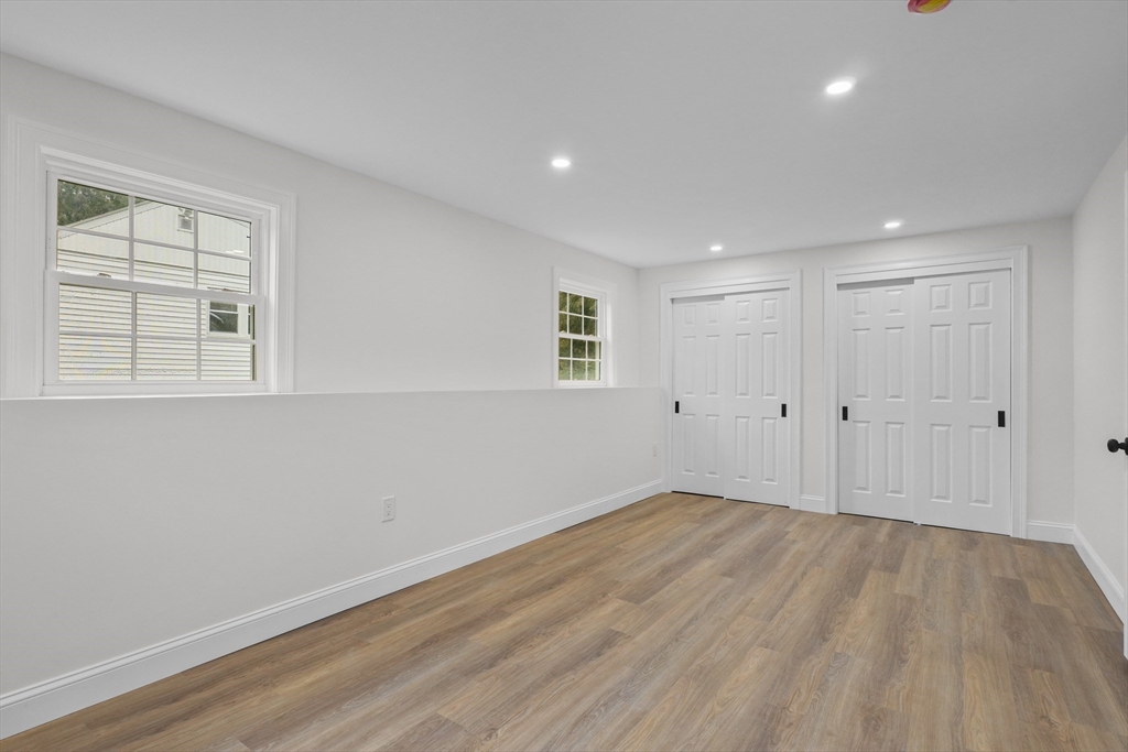 217 Central Street Framingham, MA 01701 - Photo 27 of 42 a view of empty room with wooden floor and fan