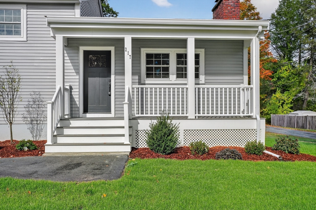 217 Central Street Framingham, MA 01701 - Photo 3 of 42 a front view of a house with a garden