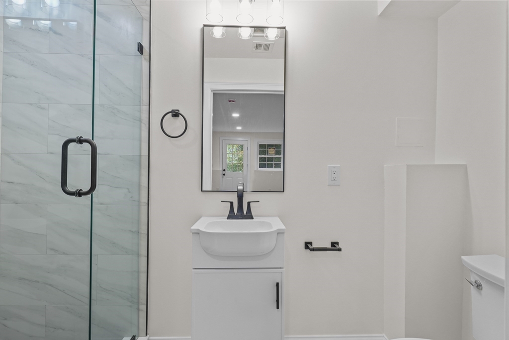 217 Central Street Framingham, MA 01701 - Photo 31 of 42 a bathroom with a sink vanity and a mirror