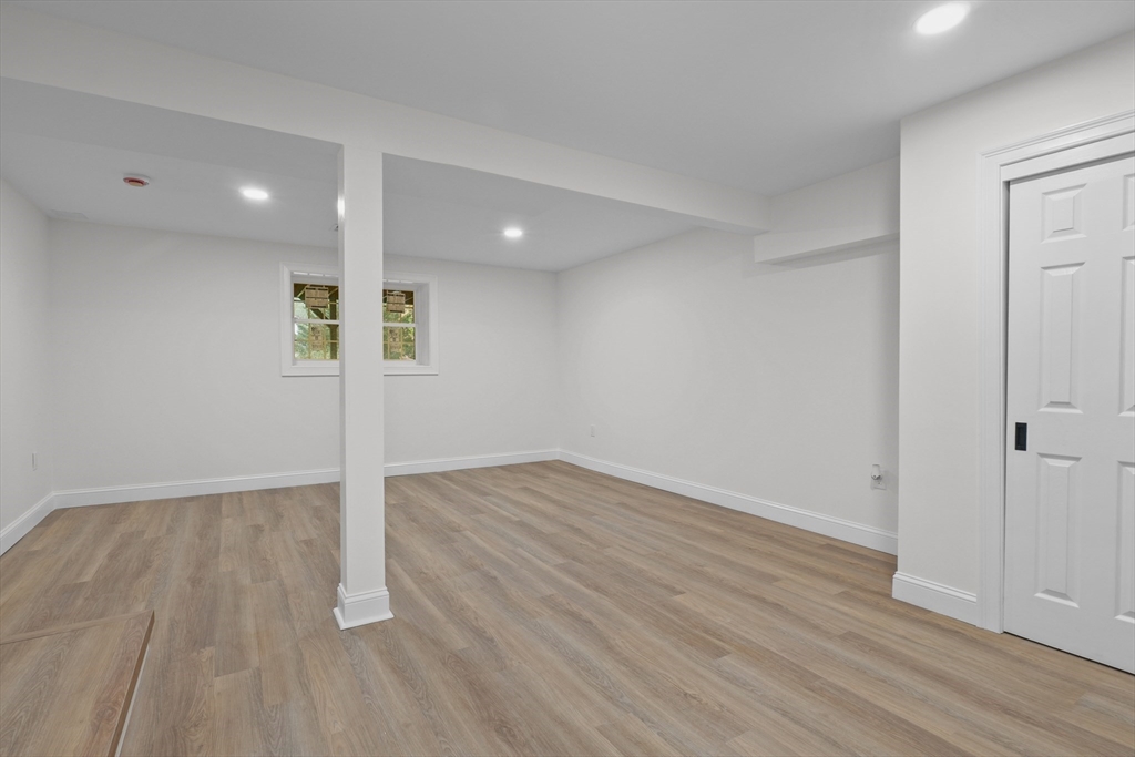 217 Central Street Framingham, MA 01701 - Photo 35 of 42 wooden floor in an empty room with a window