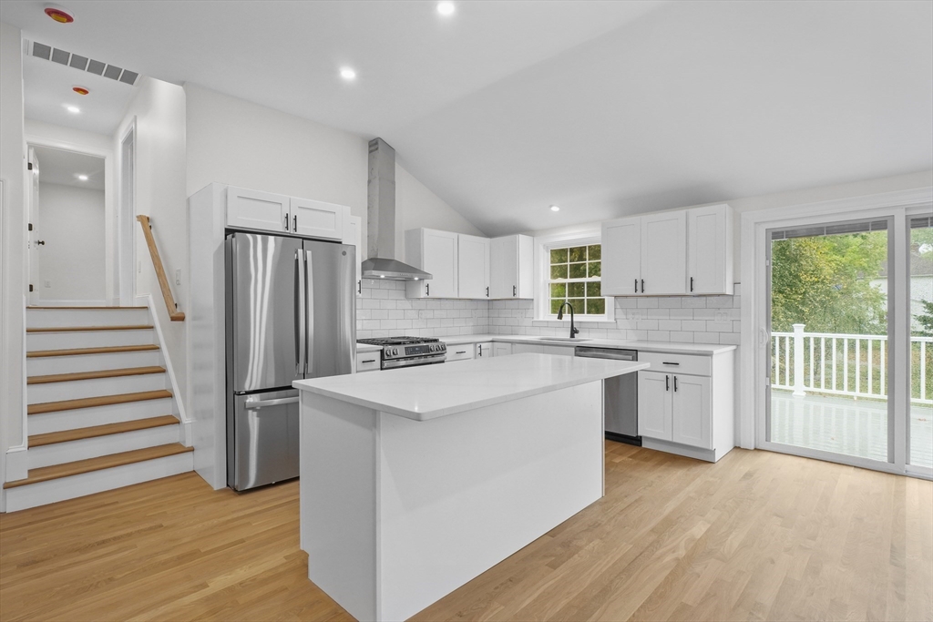 217 Central Street Framingham, MA 01701 - Photo 7 of 42 a kitchen with white cabinets and white appliances