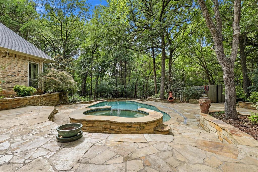 970 Crystal Cove Oak Point, TX 75068 - Photo 32 of 40 a view of a backyard with swimming pool