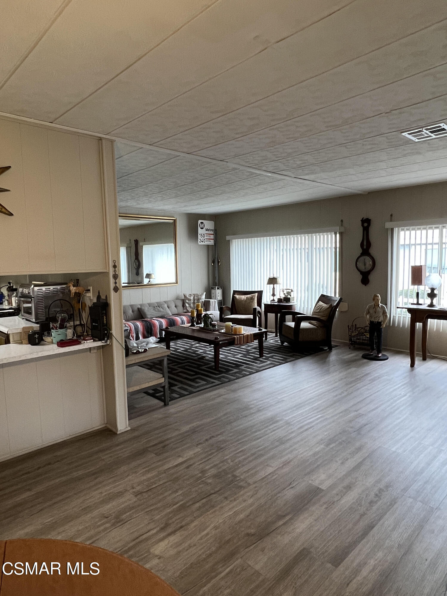 1550 Rory Lane, Unit 83 Simi Valley, CA 93063 - Photo 11 of 50 a living room with furniture and a wooden floor