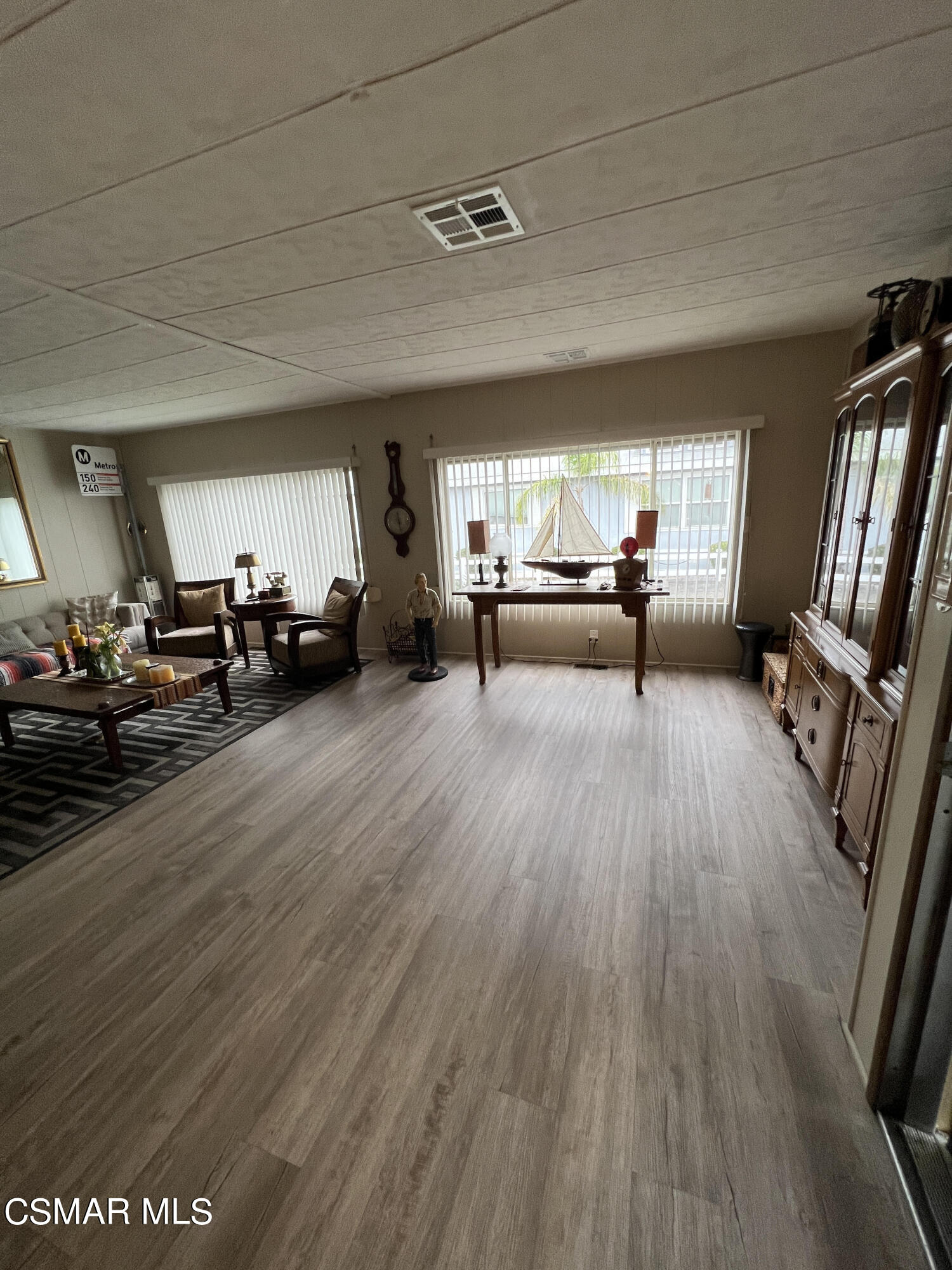 1550 Rory Lane, Unit 83 Simi Valley, CA 93063 - Photo 12 of 50 a living room with furniture and a wooden floor