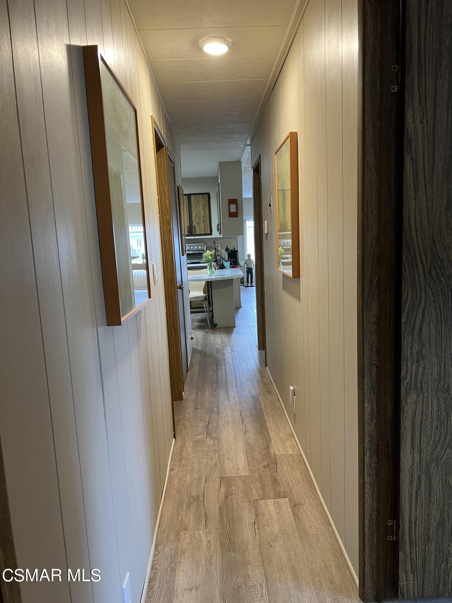 1550 Rory Lane, Unit 83 Simi Valley, CA 93063 - Photo 20 of 50 a view of a hallway with wooden floor