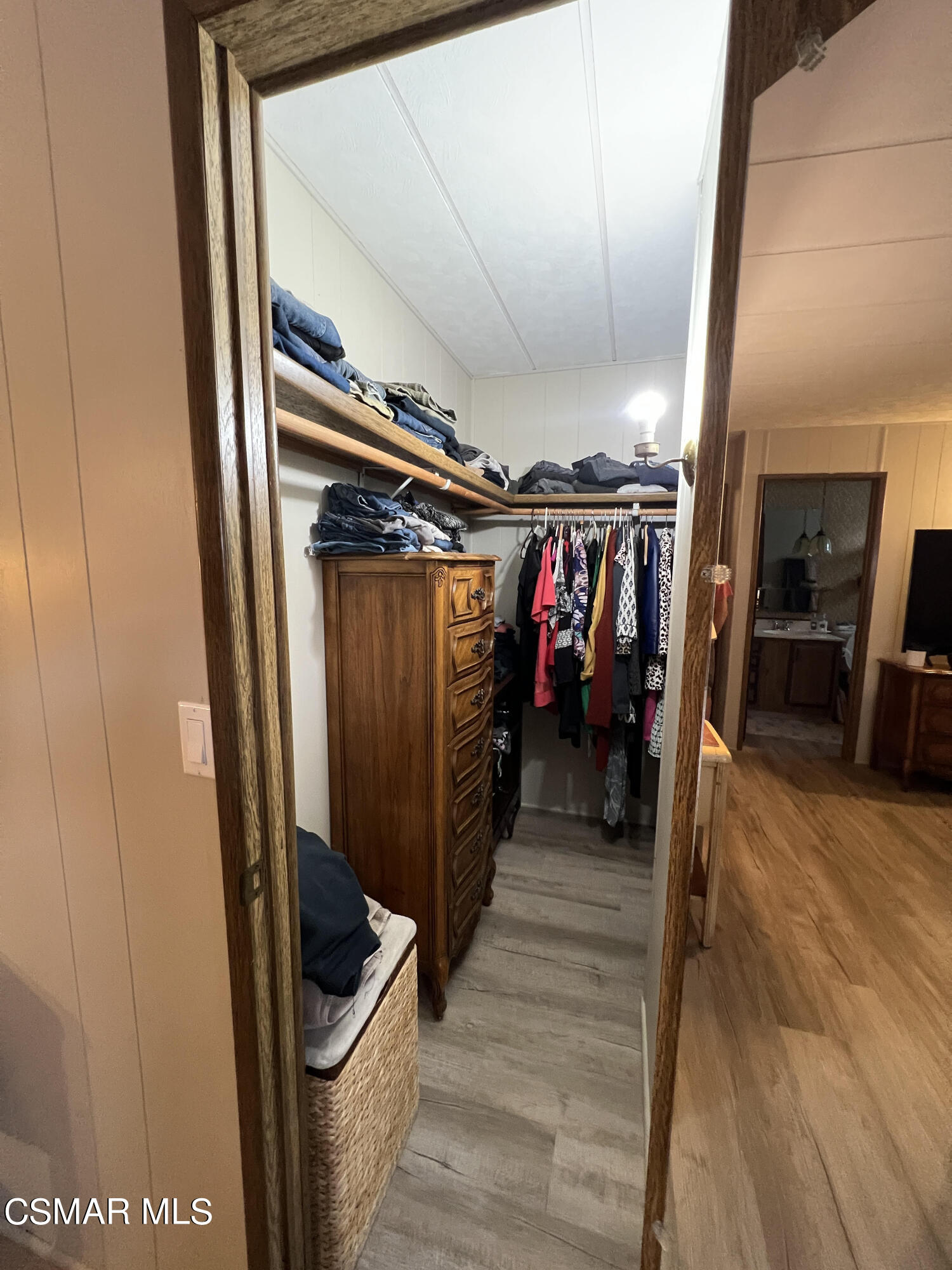1550 Rory Lane, Unit 83 Simi Valley, CA 93063 - Photo 22 of 50 a view of a hallway with wooden floor and staircase