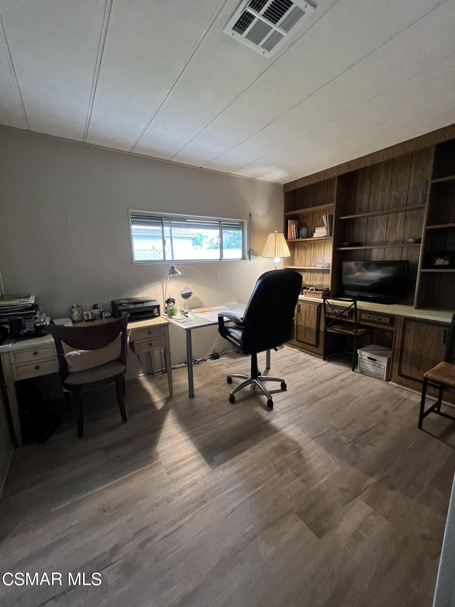1550 Rory Lane, Unit 83 Simi Valley, CA 93063 - Photo 25 of 50 a workspace with furniture hardwood and a window