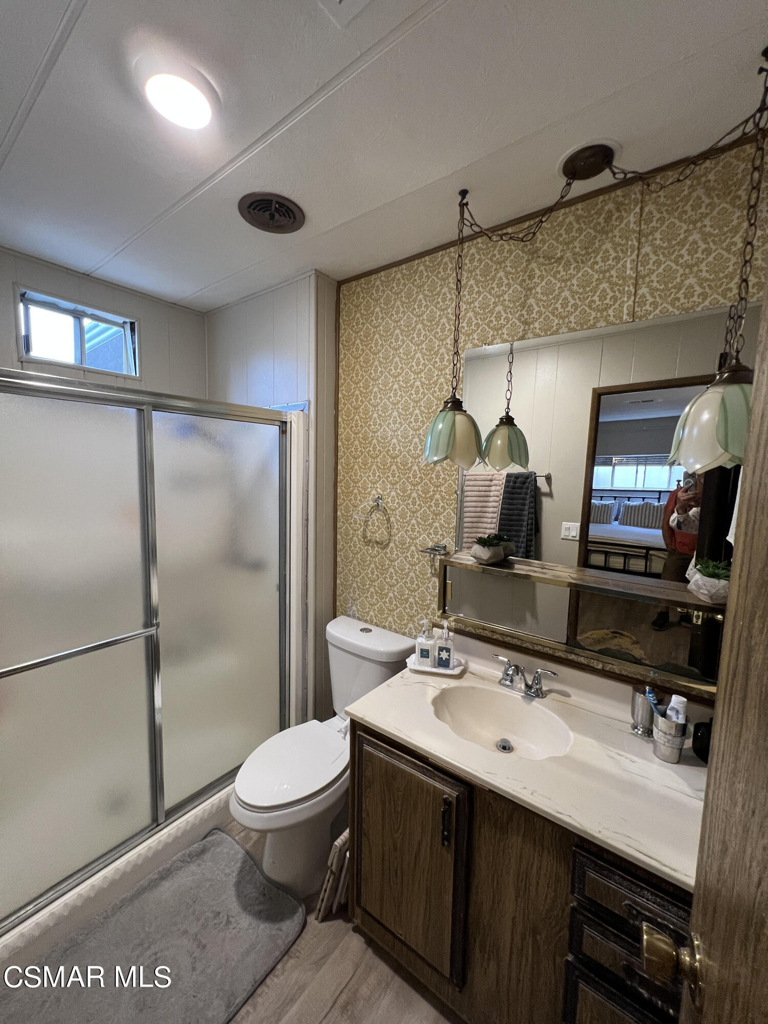 1550 Rory Lane, Unit 83 Simi Valley, CA 93063 - Photo 26 of 50 a bathroom with a sink a toilet and shower