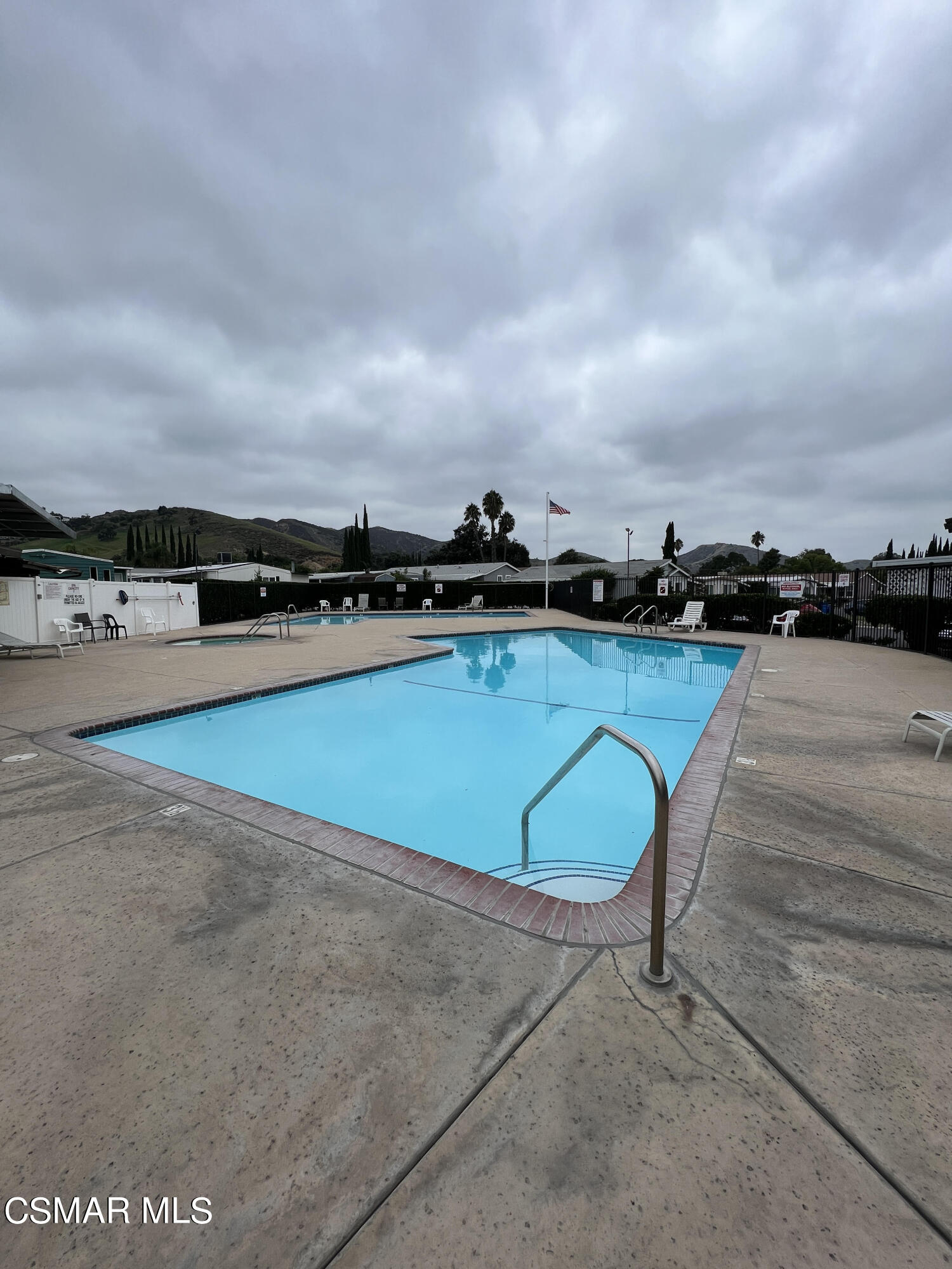 1550 Rory Lane, Unit 83 Simi Valley, CA 93063 - Photo 29 of 50 a view of a swimming pool and lounge chair