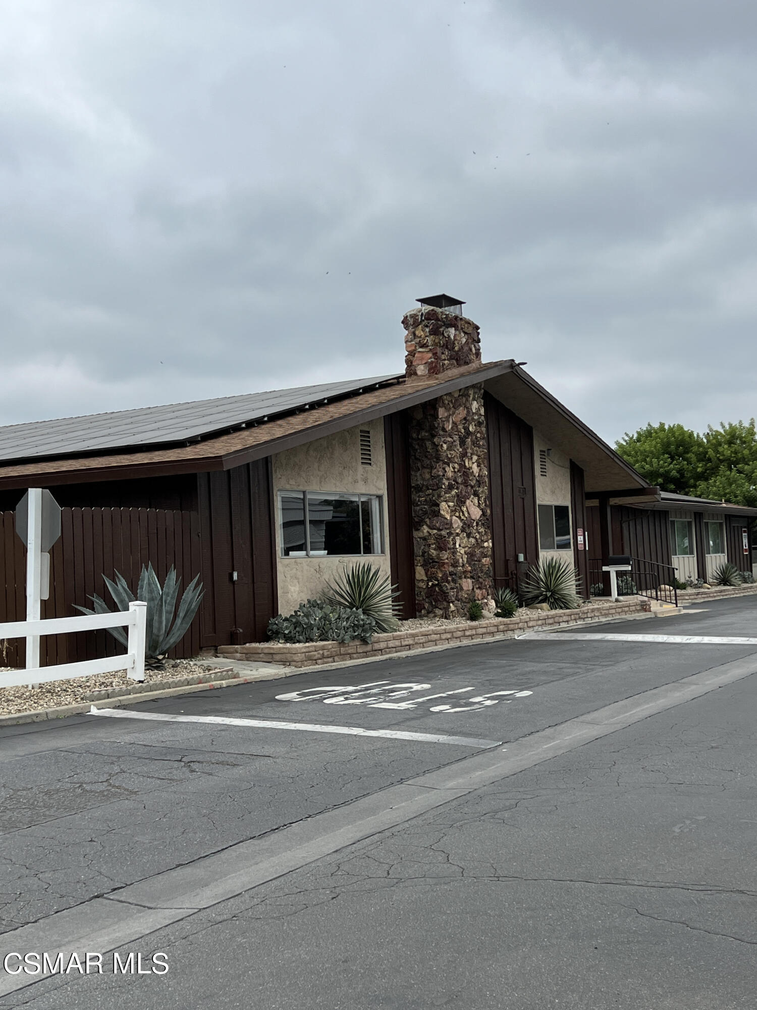 1550 Rory Lane, Unit 83 Simi Valley, CA 93063 - Photo 33 of 50 a view of a house and a entrance gate