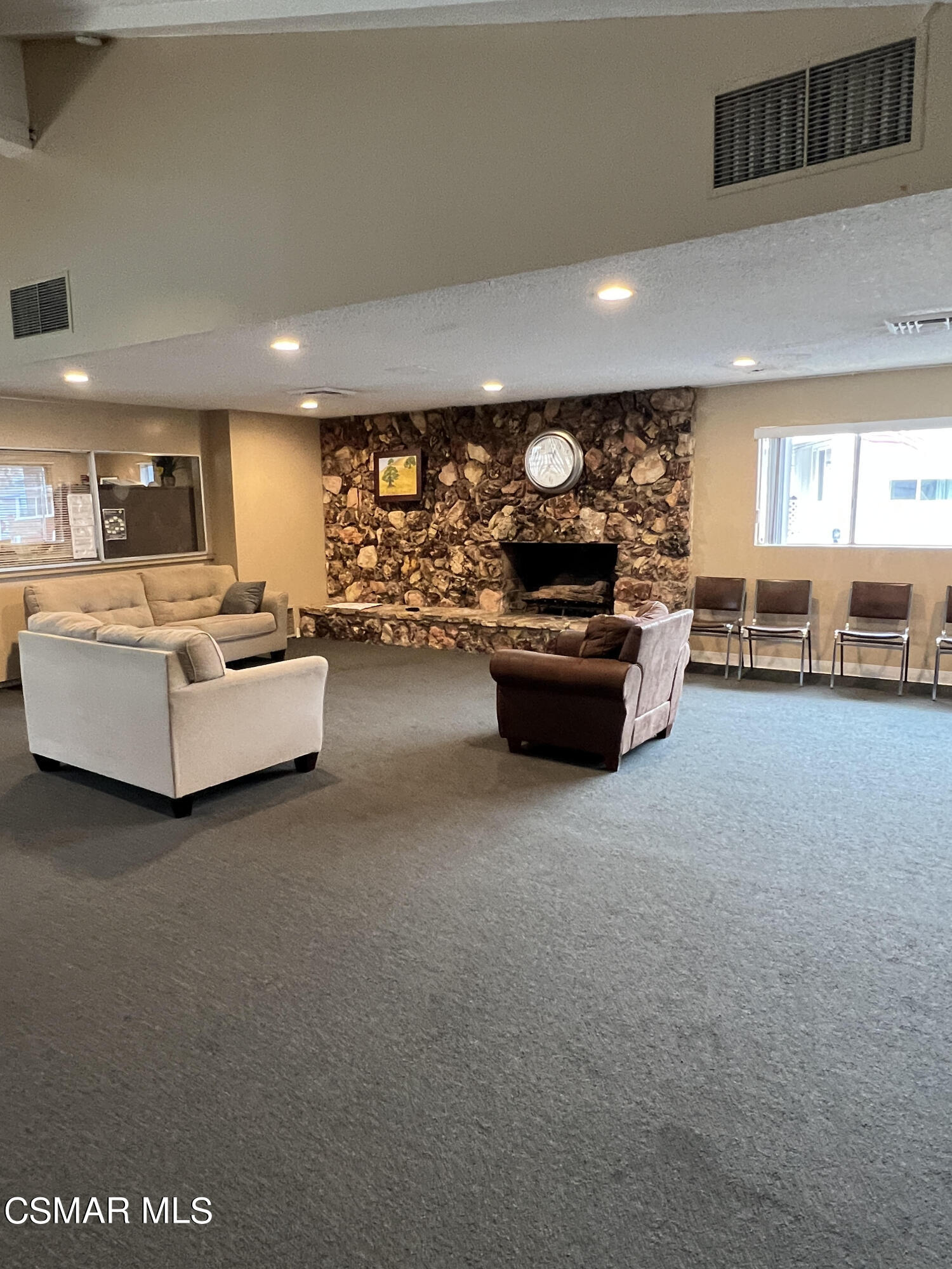 1550 Rory Lane, Unit 83 Simi Valley, CA 93063 - Photo 35 of 50 a living room with furniture and a flat screen tv