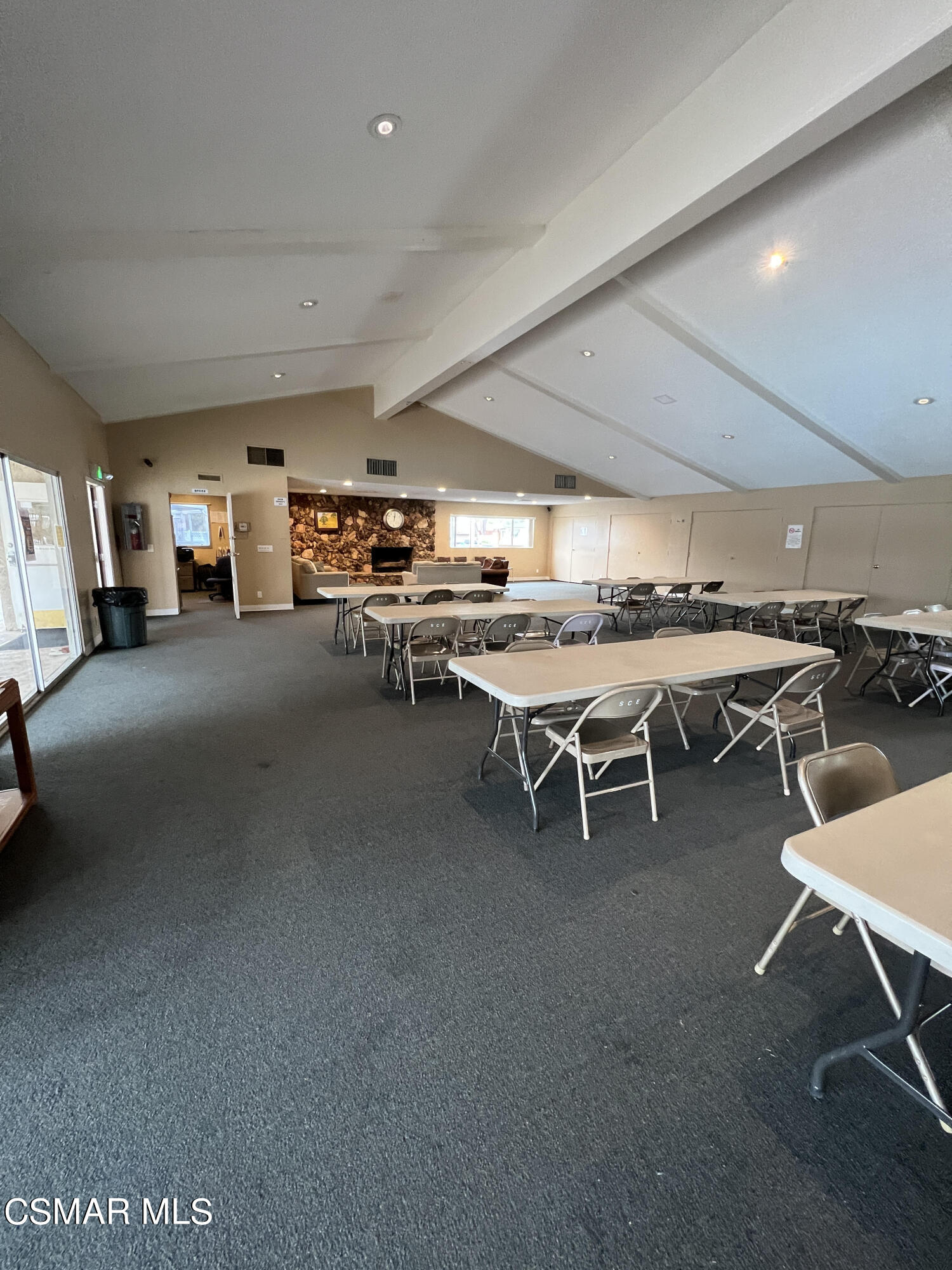 1550 Rory Lane, Unit 83 Simi Valley, CA 93063 - Photo 39 of 50 a room with lots of furniture and a projector screen