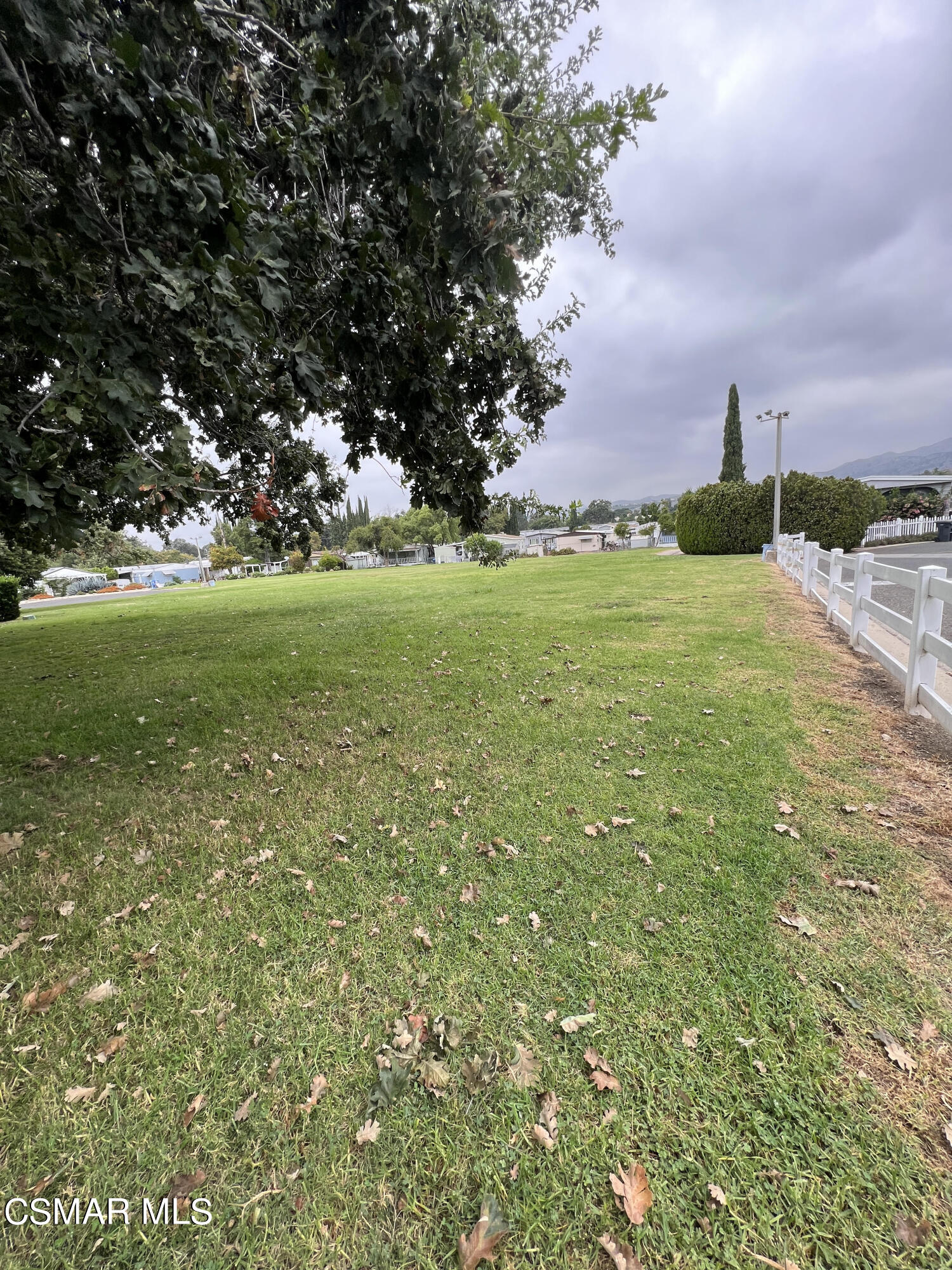 1550 Rory Lane, Unit 83 Simi Valley, CA 93063 - Photo 40 of 50 a view of a field with large trees