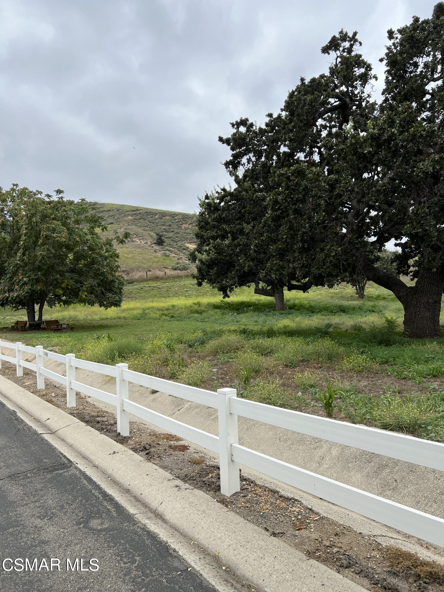 1550 Rory Lane, Unit 83 Simi Valley, CA 93063 - Photo 42 of 50 a view of a road with a big yard