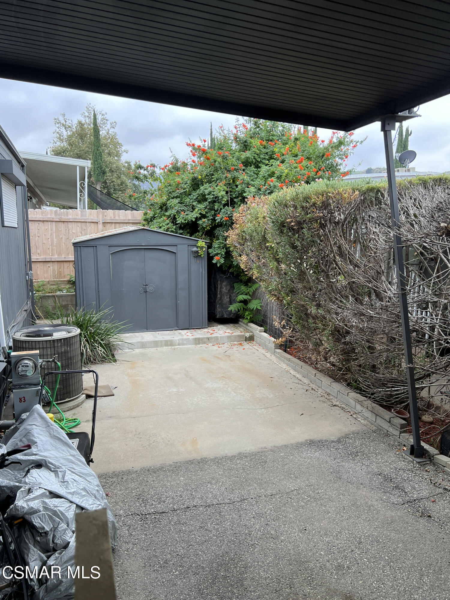 1550 Rory Lane, Unit 83 Simi Valley, CA 93063 - Photo 6 of 50 a patio with table and chairs and potted plants